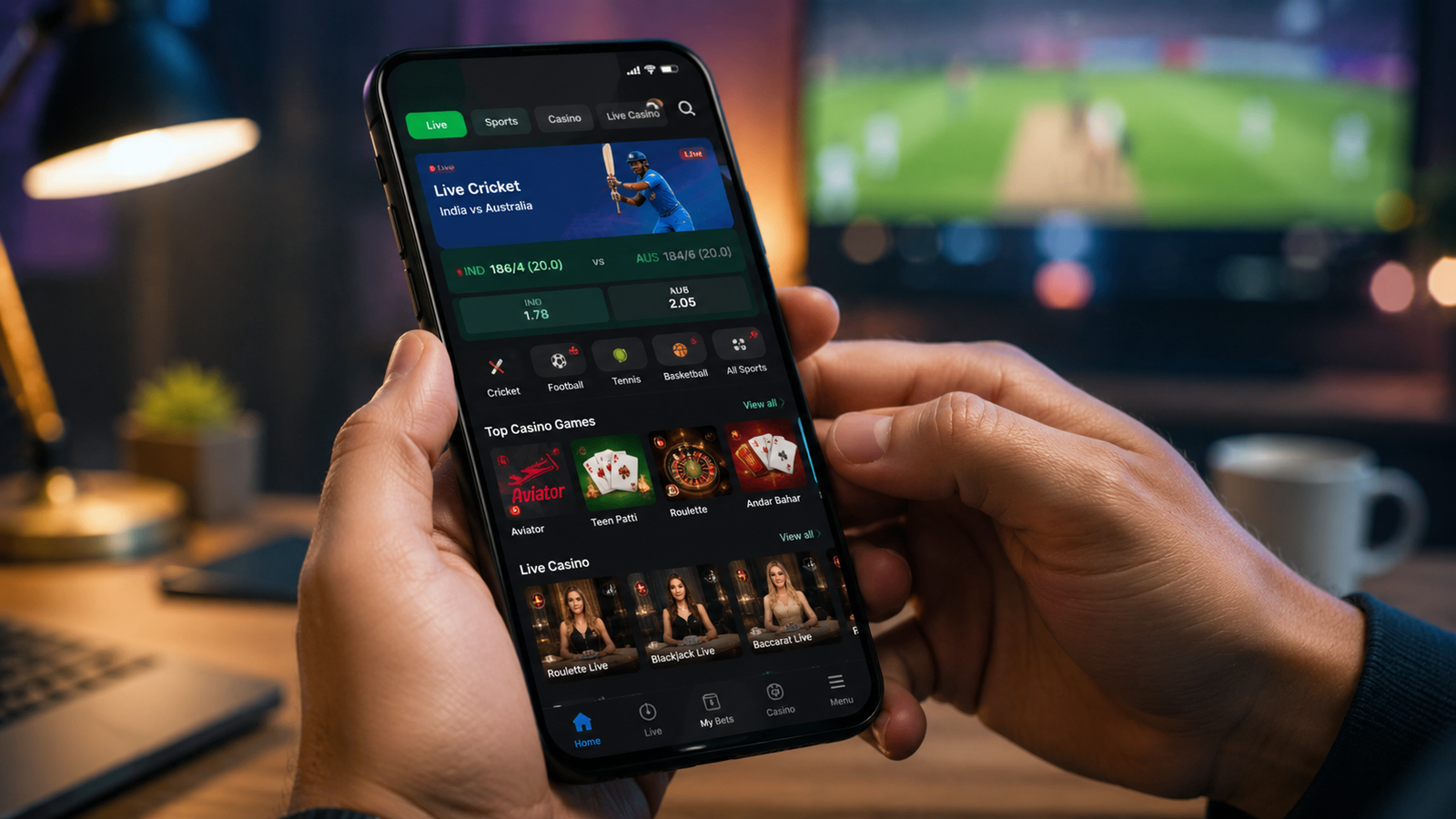 User holding a smartphone displaying a modern 1Win Online-style betting and casino gaming interface with live cricket odds and casino games.